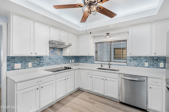 kitchen featuring black electric stovetop, white cabinetry, stainless steel dishwasher, and sink