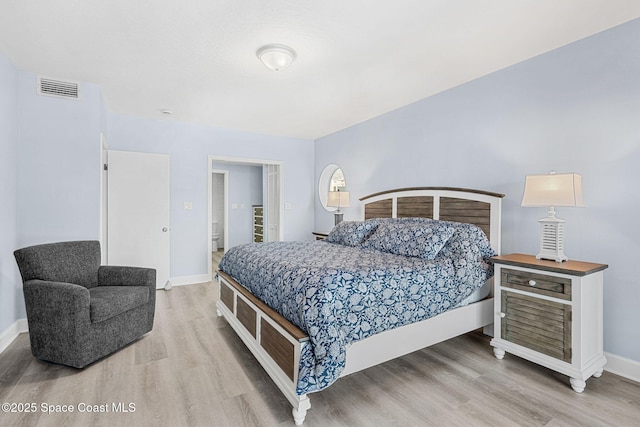 bedroom with light hardwood / wood-style flooring