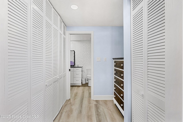 spacious closet featuring light hardwood / wood-style floors