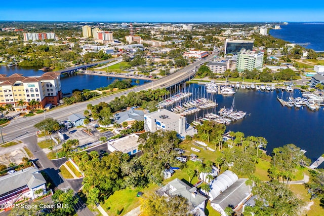 birds eye view of property with a water view