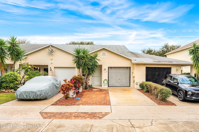 ranch-style house featuring a garage