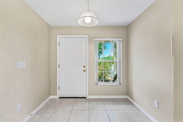 doorway featuring light tile patterned flooring