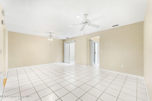 unfurnished room featuring ceiling fan and light tile patterned flooring