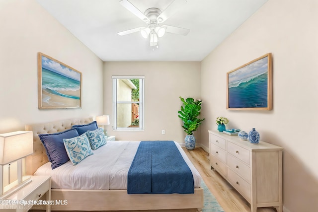 bedroom with light hardwood / wood-style flooring and ceiling fan