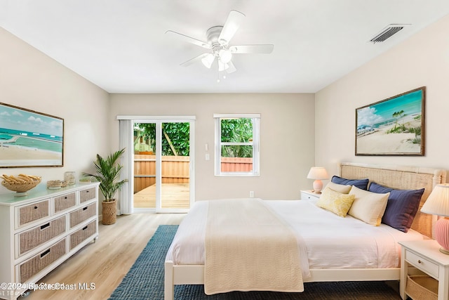 bedroom with ceiling fan, light hardwood / wood-style floors, and access to exterior