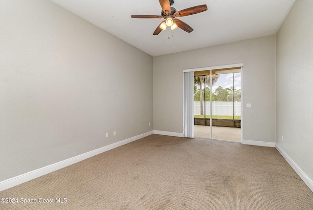 spare room with ceiling fan and carpet floors