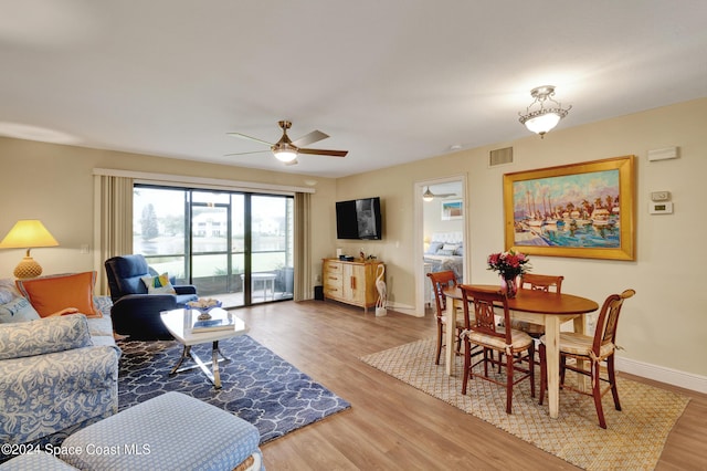 living room with ceiling fan and hardwood / wood-style floors