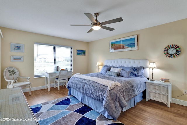 bedroom featuring hardwood / wood-style flooring and ceiling fan