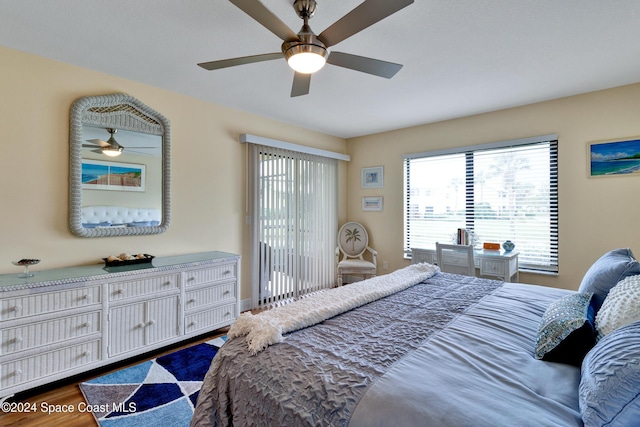 bedroom with ceiling fan and wood-type flooring