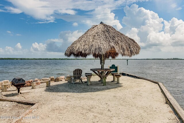 property view of water with an outdoor fire pit