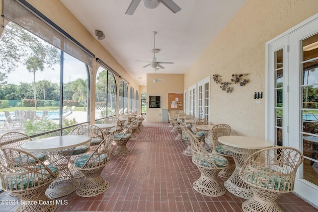 sunroom / solarium with ceiling fan