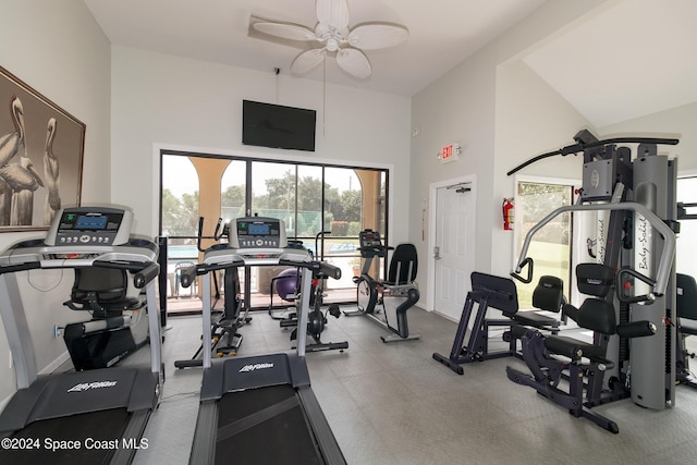 gym featuring high vaulted ceiling and ceiling fan