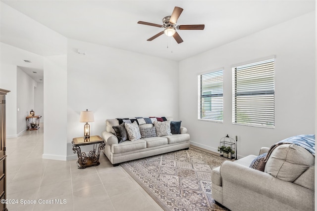 tiled living room featuring ceiling fan