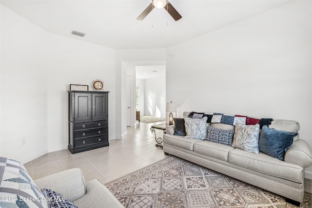 tiled living room with ceiling fan