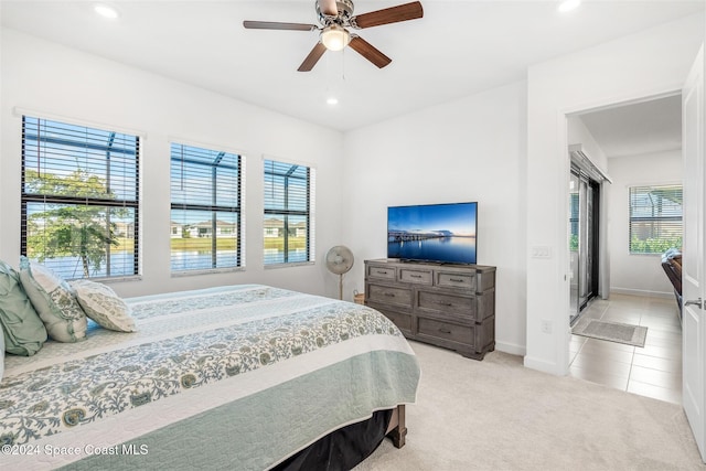 carpeted bedroom with ceiling fan