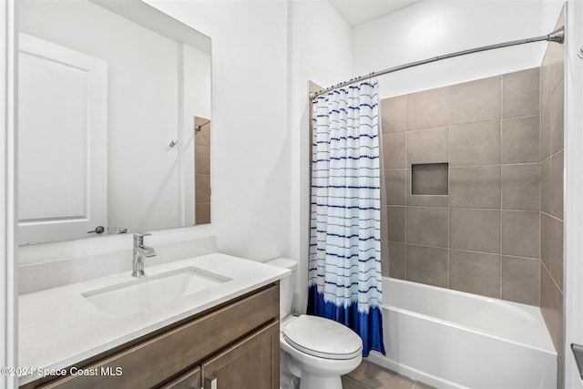 full bathroom with toilet, vanity, and shower / tub combo with curtain