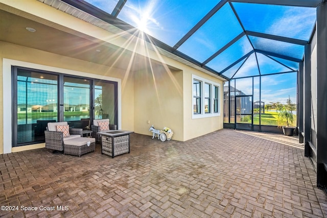 view of patio with an outdoor hangout area and a lanai