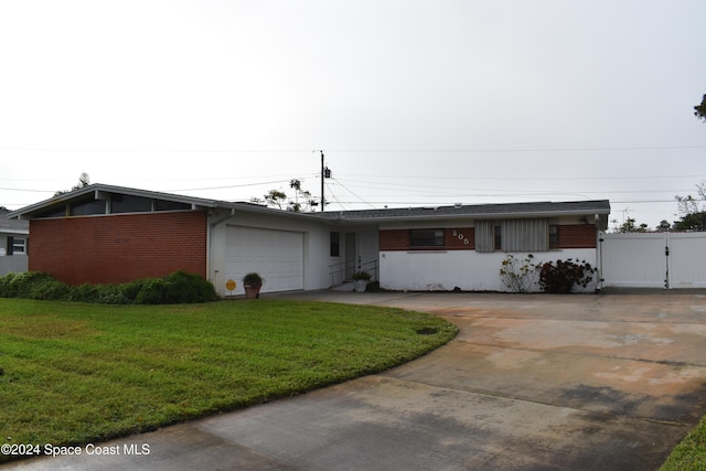 ranch-style house with a front yard and a garage