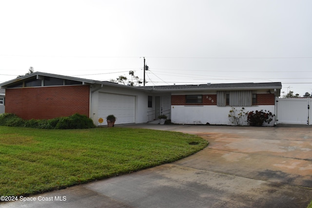 ranch-style house with a front yard and a garage