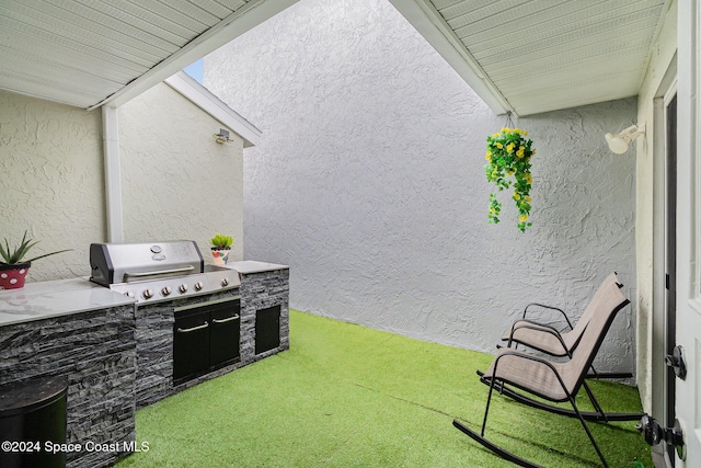 view of patio / terrace featuring a grill and exterior kitchen