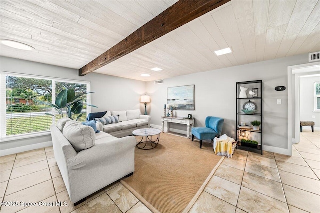 tiled living room with beamed ceiling