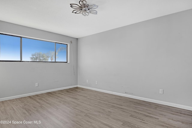 spare room with light hardwood / wood-style floors