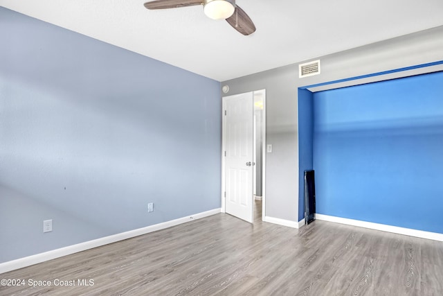 unfurnished bedroom with hardwood / wood-style flooring and ceiling fan