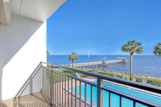 balcony featuring a water view