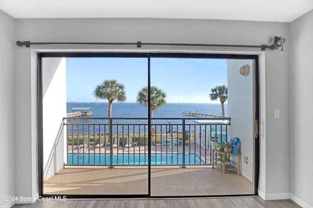 view of swimming pool featuring a water view