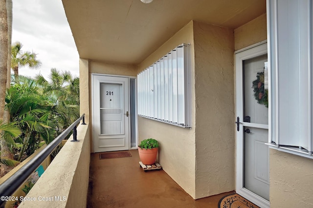 doorway to property featuring a balcony