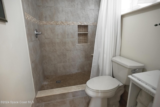 bathroom with toilet and walk in shower