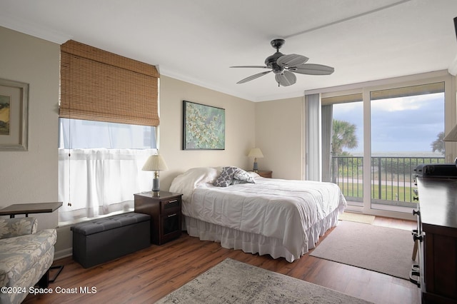 bedroom featuring access to exterior, ceiling fan, crown molding, and dark wood-type flooring