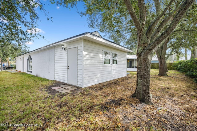 view of home's exterior with a lawn