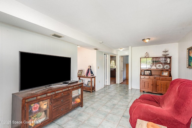 living room with a textured ceiling