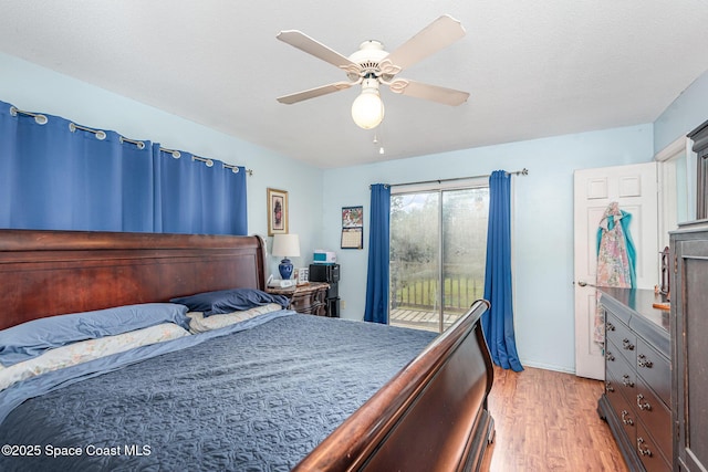 bedroom featuring access to exterior, ceiling fan, and light hardwood / wood-style floors