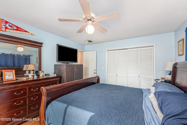 bedroom featuring ceiling fan and a closet