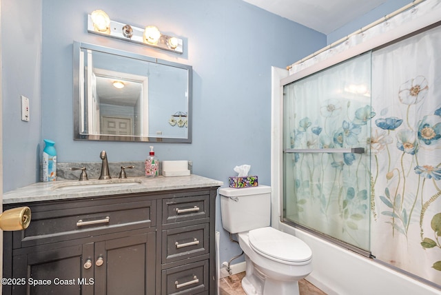 full bathroom with vanity, toilet, and enclosed tub / shower combo