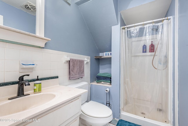 bathroom with a shower with curtain, backsplash, toilet, vanity, and tile walls