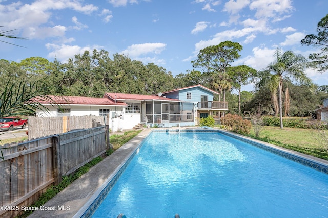 view of pool with a sunroom