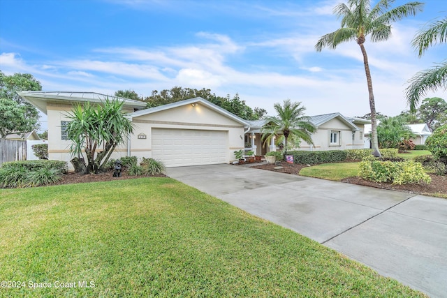 single story home with a front yard and a garage