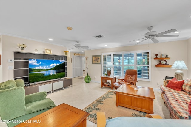 tiled living room featuring ceiling fan and ornamental molding