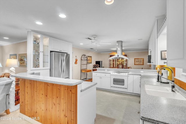 kitchen with kitchen peninsula, white range with electric stovetop, white cabinetry, island exhaust hood, and stainless steel refrigerator