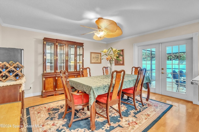 dining area featuring crown molding, french doors, ceiling fan, and light hardwood / wood-style floors