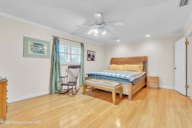 bedroom with ceiling fan, light wood-type flooring, and crown molding