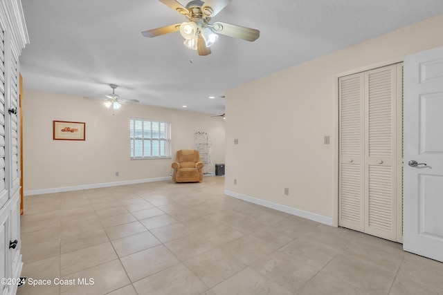 unfurnished room featuring light tile patterned floors