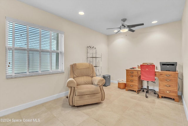 office with tile patterned flooring and ceiling fan