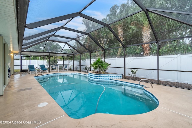 view of pool with a lanai and a patio area