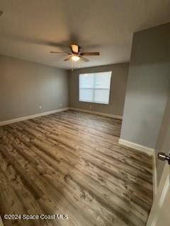 unfurnished room featuring ceiling fan and hardwood / wood-style flooring