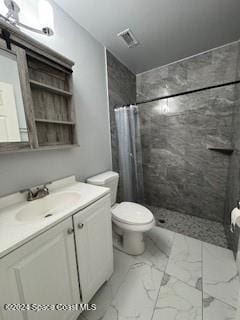 bathroom featuring curtained shower, vanity, and toilet