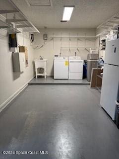 interior space with white fridge, washing machine and dryer, and sink